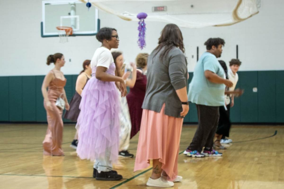 Students and teachers line up to dance the wobble.